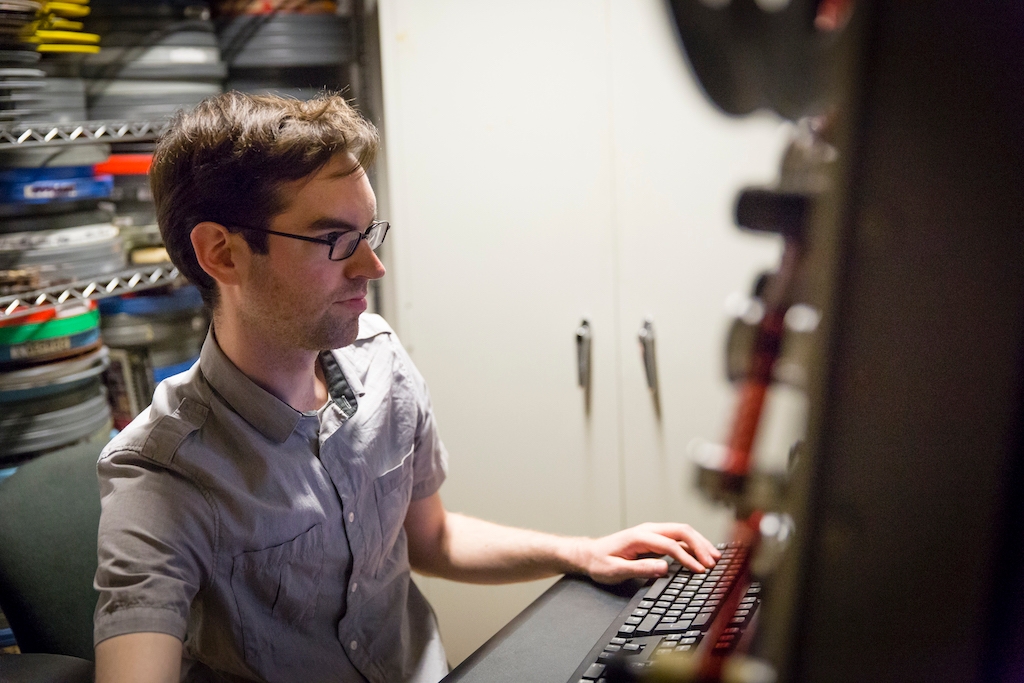 Student working at a computer in the Cinema Studies department